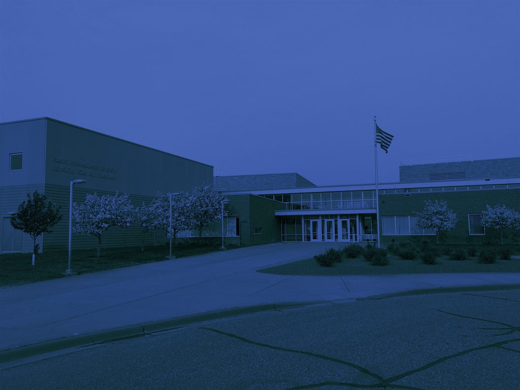 Outdoor view of high school with blue overlay