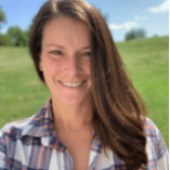 Headshot of woman standing outside