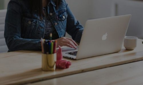 Lady working on apple laptop