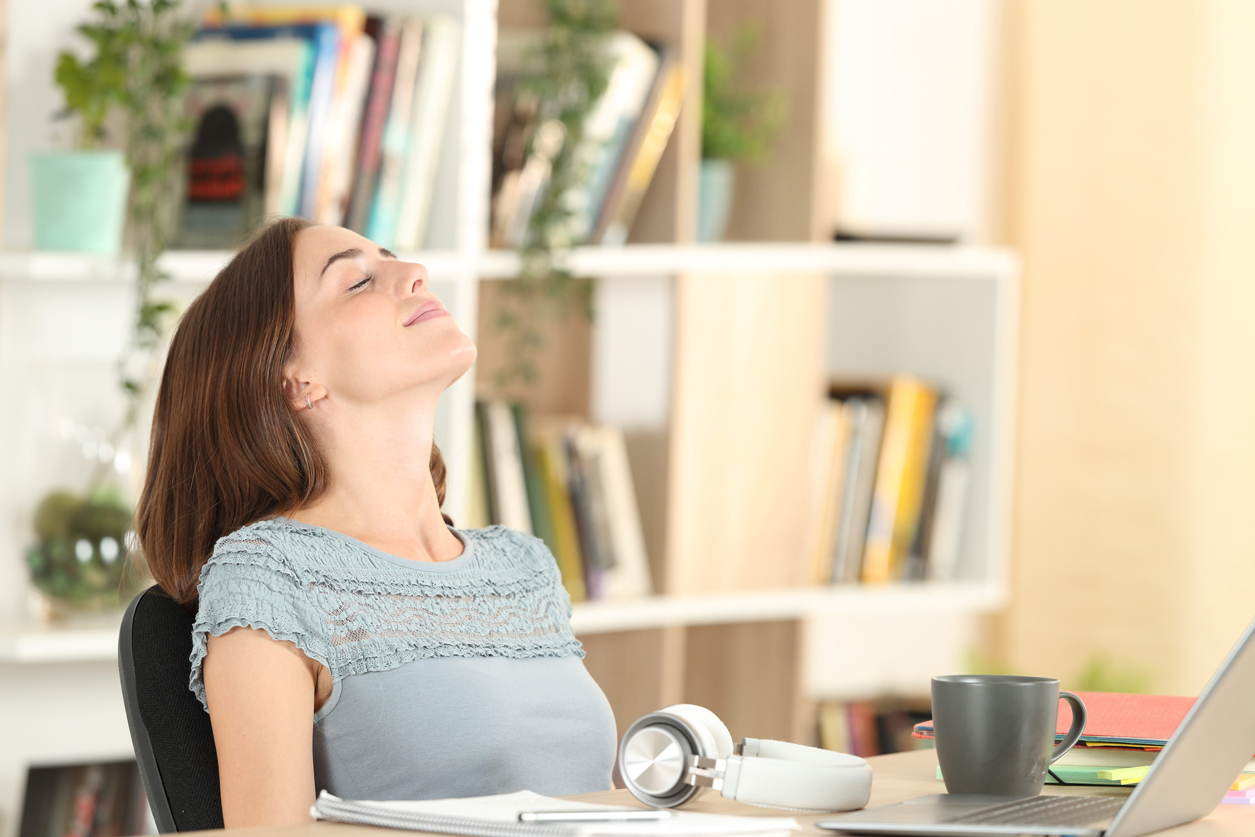 Educator Practicing Self Care, Relaxing at Desk