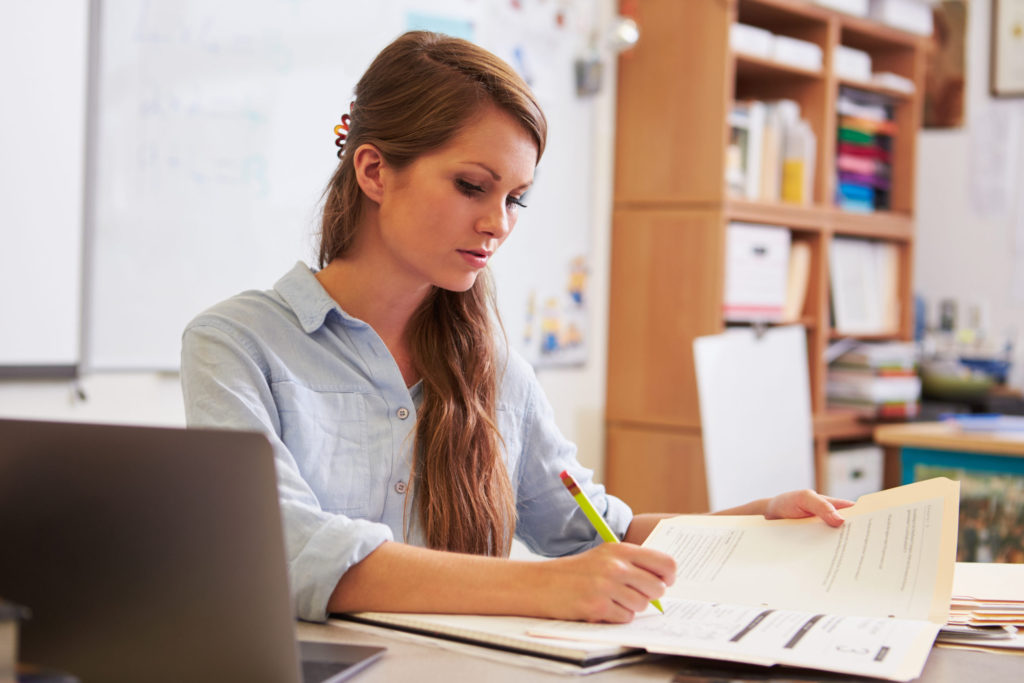 K-12 Educator Working at Desk