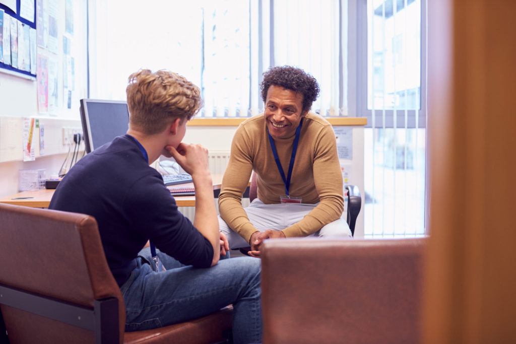 Educator working with K-12 student on mental health